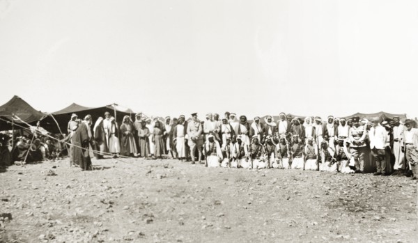A meeting with Arab leaders. Two British officials pose for a group portrait with Arab leaders