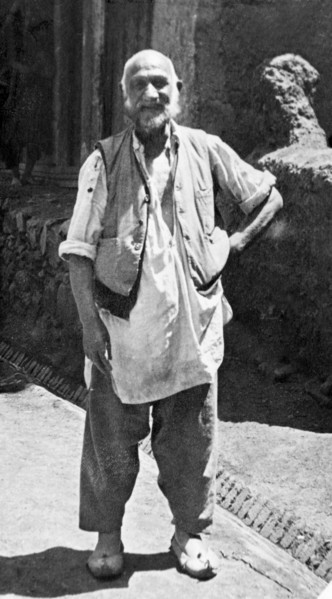 A Kashmiri 'dhobi'. Full-length portrait of a Kashmiri dhobi' (laundryman) dressed in a loose