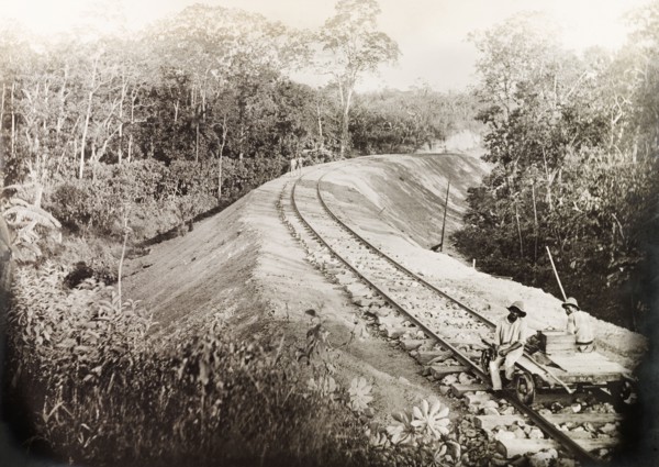 A newly completed section of the Siparia line. Two Trinidad Government Railway workers sit on a
