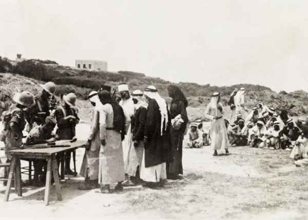 British military questioning Palestinian Arabs. British military officers question a group of Arab