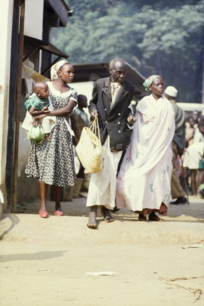A Batoro family at Mpanga market. Members of a well-to-do Batoro family shop at Mpanga market in