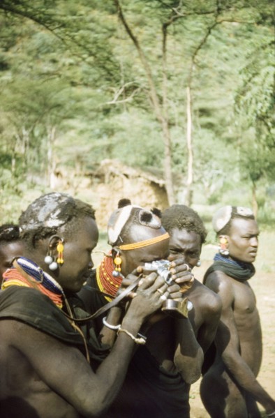 Henry Osmaston's Leica'. Suk (Pokot) porters working with a British forestry survey team experiment