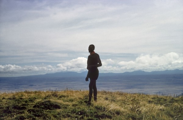 Porter on the summit of Mount Napak. A porter working with a British forestry survey team stands