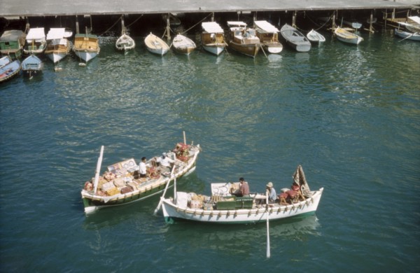 Bumboats at Port Said'. Two bumboats filled with trade wares float in the harbour at Port Said.