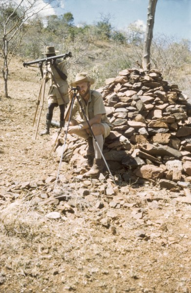 Surveying with 'kituti' markers. District Forest Officer James Lang Brown (right) is accompanied by