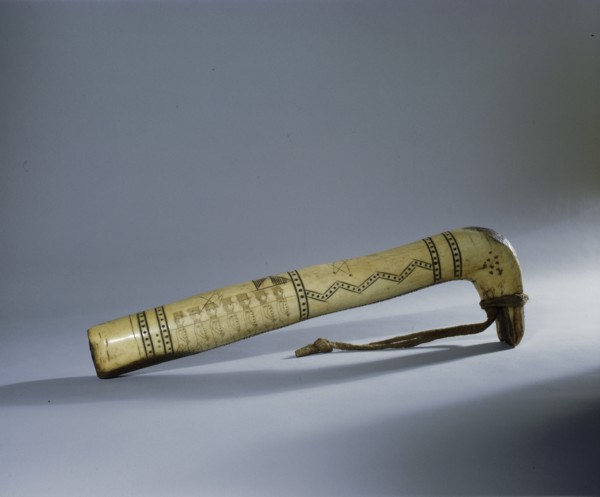 Adze or scraper handle incised with a row of American soldiers