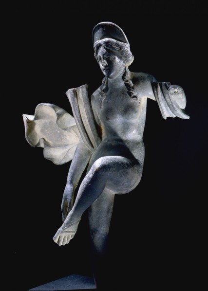 A statue of a Dancing Venus with flowing drapery and an arching canopy over her head