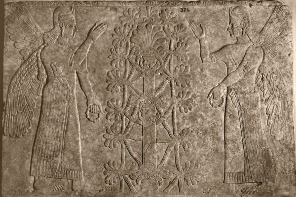 Two winged protective spirits before the sacred tree of life
