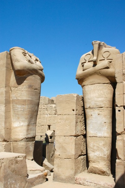Two headless statues of a pharaoh