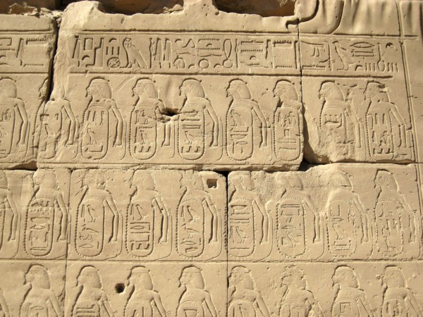 Relief of hieroglyphic insription and captive in the Cachette Court