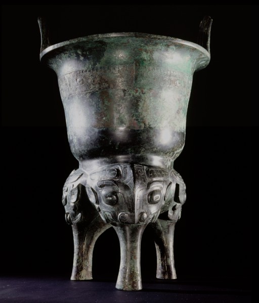Archaic bronze vessel, Li Ding, with long tao tieh masks on the legs