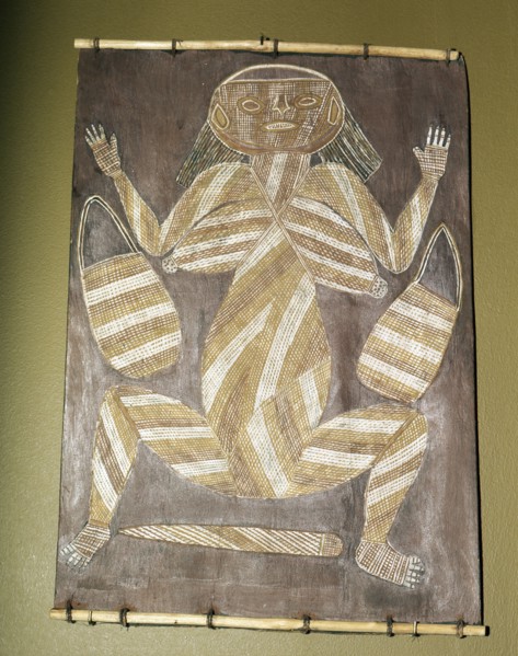 Bark painting from western Arnhem land, depicting a woman with two dilly bags and a digging stick