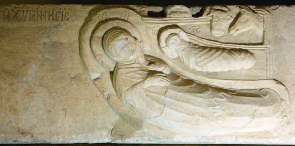 Slab with representation of the nativity scene, watched by animals