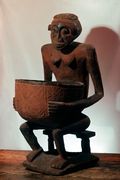 A seated female bowl figure, probably a royal prestige object