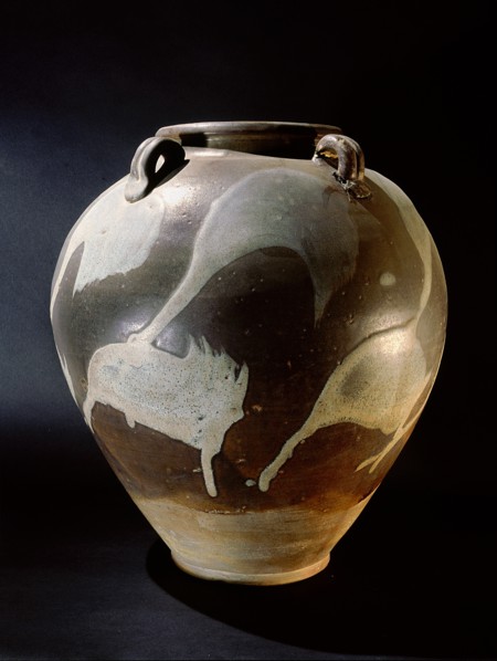 Brown and cream glazed vessel
