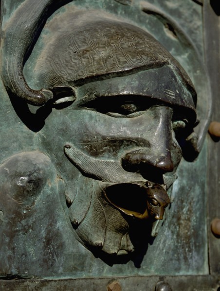 Detail of the bronze door of the Basilica of San Zeno which is decorated with 48 panels illustrating biblical stories and the lives of St Peter, St Paul, St Zeno, St Helena among others, and items con...