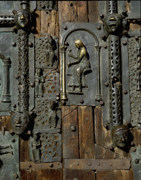 Detail of the bronze door of the Basilica of San Zeno which is decorated with 48 panels illustrating biblical stories and the lives of St Peter, St Paul, St Zeno, St Helena among others, and items con...