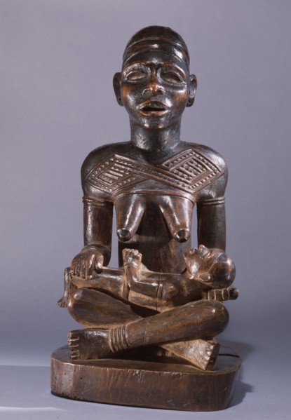 Mother and child carving (phemba) honouring female reproductive poweran idealised image of womens role and by implication of the growth and wealth of the kingdom