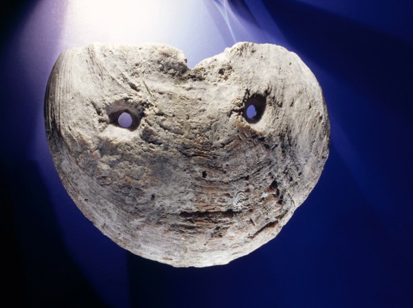 Mask made from a large spondylus shell with cut out eye holes
