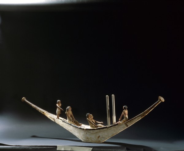 A model of a rowing boat with crew and two steering posts