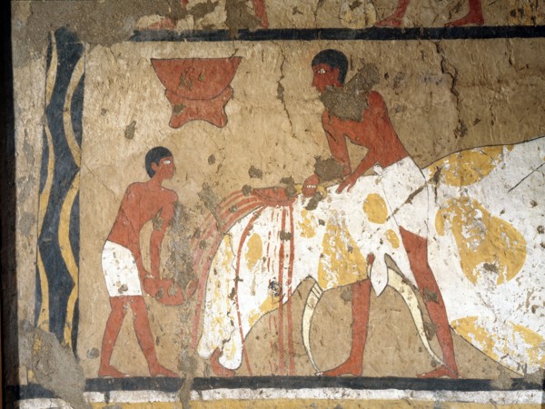 A painting from the tomb of Ity depicting the slaughtering of an ox