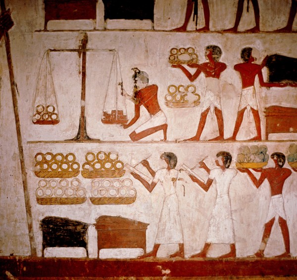 A detail of a wall painting in the tomb of Panekhmen depicting metal workers weighing gold on scales