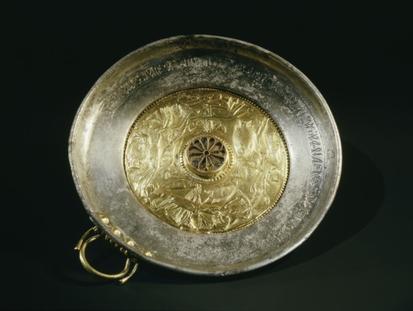 Silver bowl with gold handle and inset repousse gold centre, decorated with an aquatic scene showing four young girls swimming amongst lotus flowers and fish