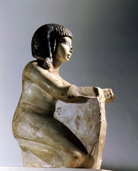 Painted stone figure of a kneeling woman, from an offering scene