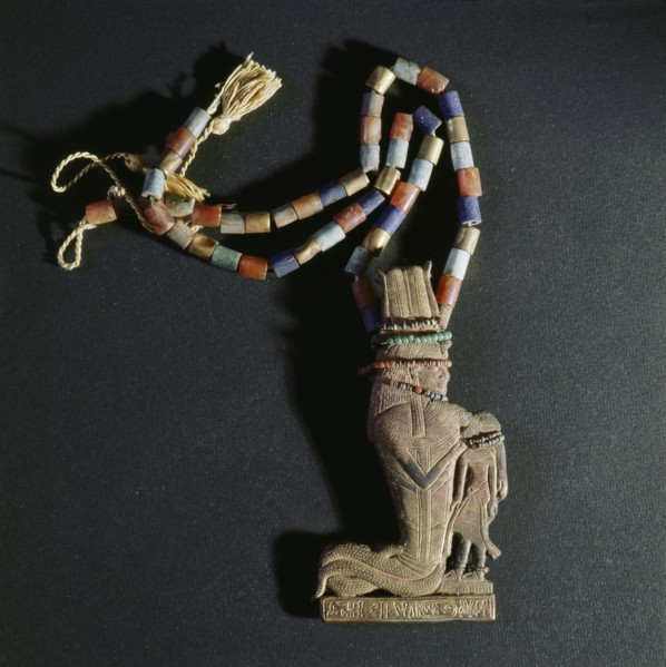 A pendant of gold attached to a string of beads