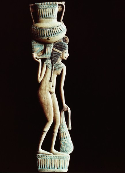 A cosmetic spoon in the form of a naked young woman carrying an amphora on her shoulder and a bag