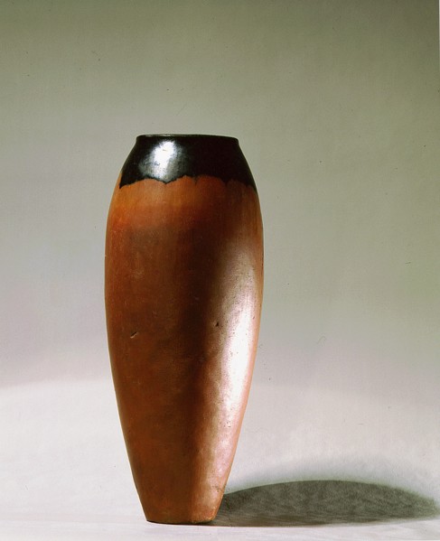 Tall pottery vessel with curved sides