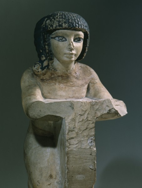Painted stone figure of a kneeling woman, from an offering scene