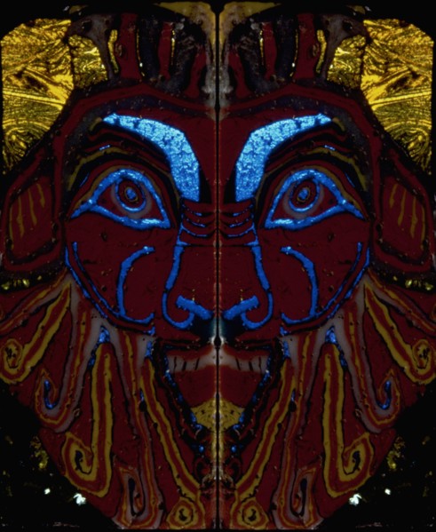 Glass fragments, two half faces of Bes