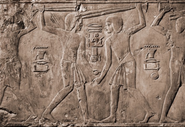 Relief from the tomb of Kharuef of young men in light tunics stick fighting