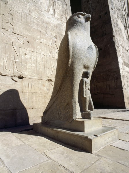 The colossal statue of the god Horus at the entrance to the Temple of Horus, Edfu