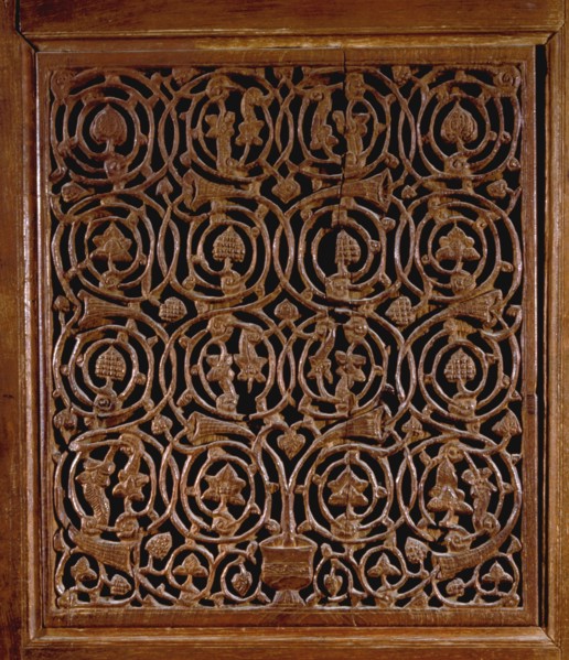 Detail of a door with vines and foliage decoration