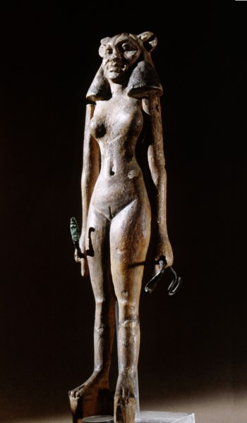 Figurine of a nude female dancer wearing a leonine mask, holding a bronze serpent in each hand