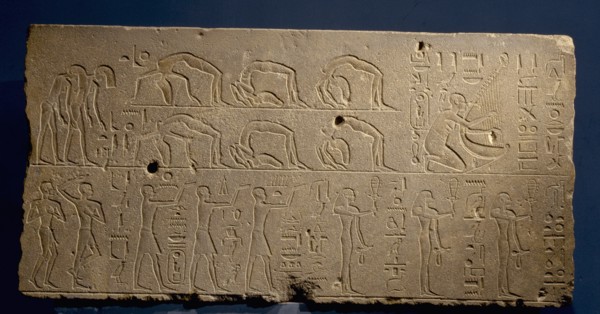 A relief depicting a musicians and acrobats