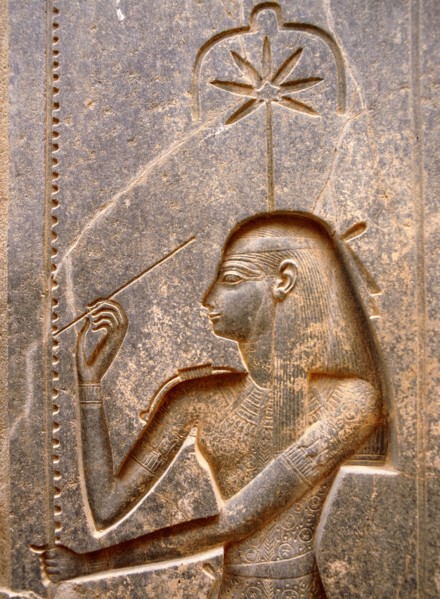The goddess Seshat, personification of Writing, shown in the act of inscribing the palm leaf rib which denotes the word renpet, year in the hieroglyphic script
