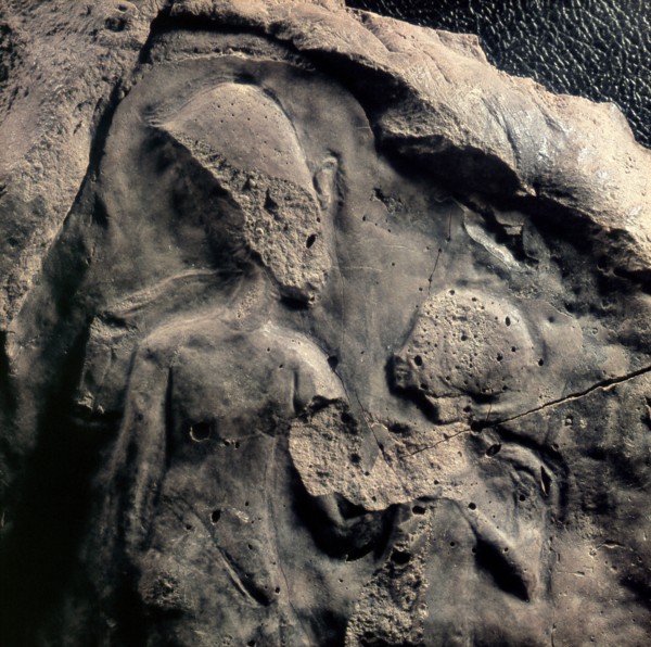 A unfinished relief fragment with the figures of Akhenaten and a child