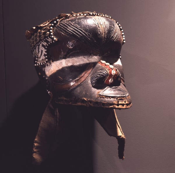 A helmet mask known as Mboom or Bwoom representing local pygmies, the common people, in a play retelling the myth of Bushoong royal origins, performed at major funerals, royal ceremonies and initiatio...