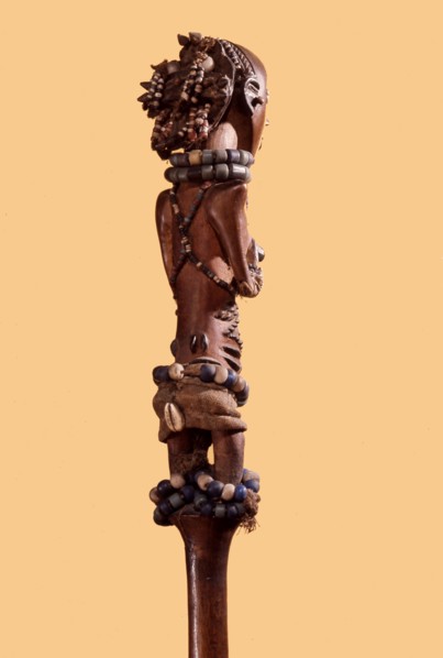 Wooden figure of a young Luba girl decorated with beads and body scarification, forming the finial of a chief or kings staff or sceptre