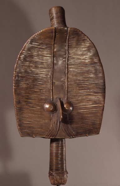 Guardian figures, called boho na bwete attached to bark boxes or bundles containing bones and other relics of clan or village ancestors, serving to protect them and as a focus for prayers and sacrific...