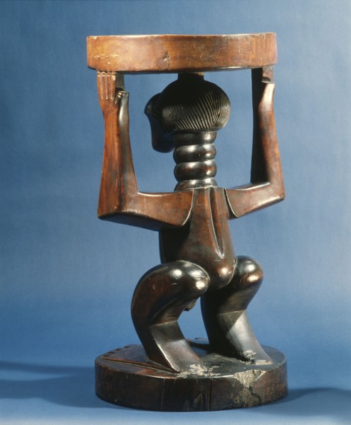 Stool supported by a male figure, served as an emblem of status and prestige for Songye chiefs