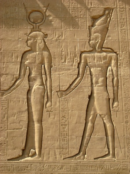 Reliefs on the outer back walls of the temple complex depicting a pharaoh and the goddess Isis