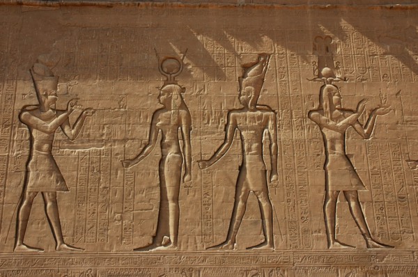 Reliefs on the outer back walls of the temple complex depicting a pharaoh burnign incense for the goddess Isis
