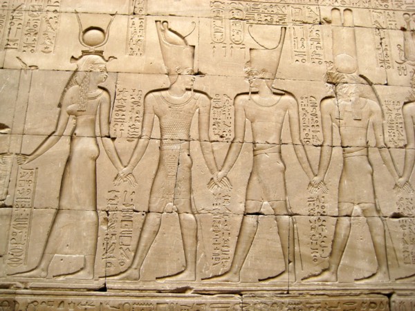 Reliefs on the outer back walls of the temple complex depicting a procession of gods and goddesses holding hands