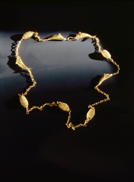 Hellenistic gold necklace chain interlinked with four gold dolphins and five twisted wire beads