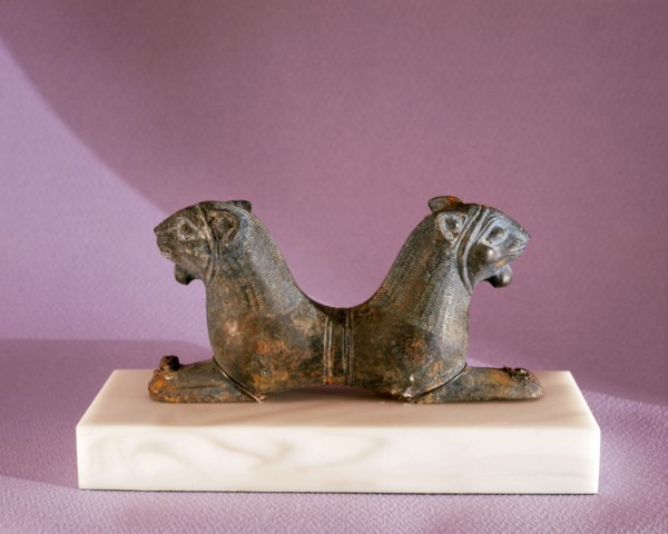 A double headed lion reclining