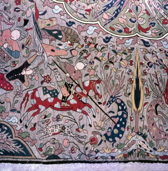 Detail of a Persian style carpet showing hunters on horseback